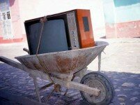 Television Tied in Wheelbarrow in Street